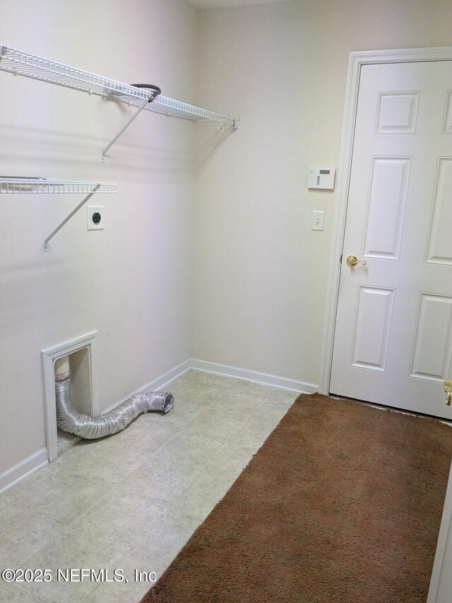 124 Hondo Dr, Saint Augustine, FL 32086 - washroom featuring electric dryer hookup, baseboards, and laundry area