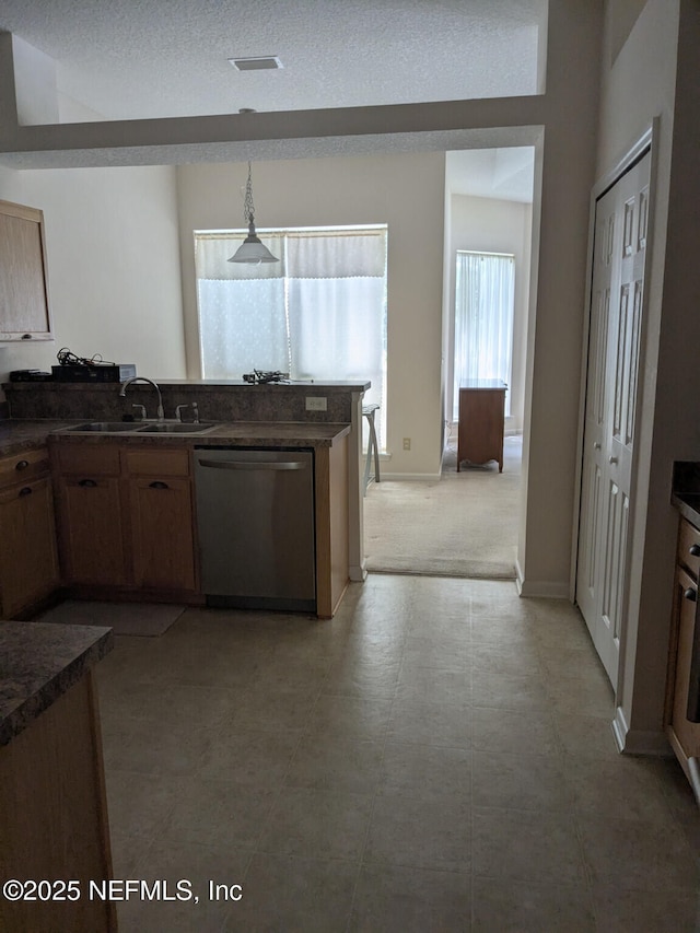 124 Hondo Dr, Saint Augustine, FL 32086 - kitchen with a sink, visible vents, dark countertops, hanging light fixtures, and dishwasher