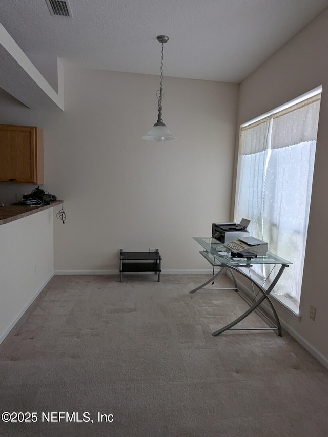 124 Hondo Dr, Saint Augustine, FL 32086 - dining area featuring baseboards, visible vents, and light colored carpet