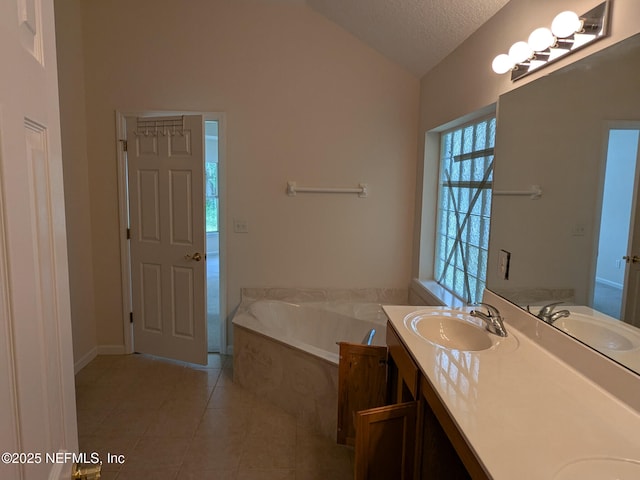 124 Hondo Dr, Saint Augustine, FL 32086 - full bathroom with a sink, double vanity, vaulted ceiling, a textured ceiling, and tile patterned flooring