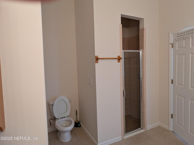 124 Hondo Dr, Saint Augustine, FL 32086 - bathroom featuring tile patterned floors, baseboards, a shower stall, and toilet