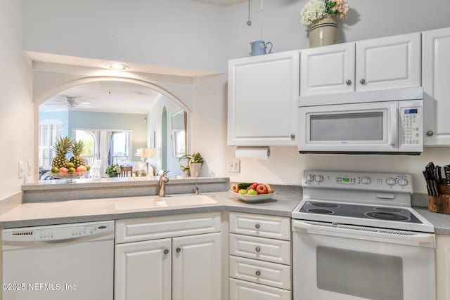 2229 Vista Cove Rd, Saint Augustine, FL 32084 - kitchen featuring white appliances, white cabinetry, a sink, and a ceiling fan