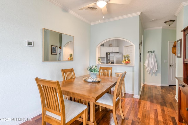 2229 Vista Cove Rd, Saint Augustine, FL 32084 - dining space with dark wood-type flooring, a ceiling fan, ornamental molding, and baseboards
