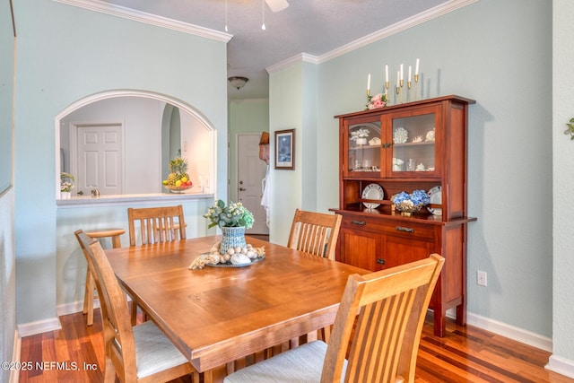 2229 Vista Cove Rd, Saint Augustine, FL 32084 - dining room featuring wood finished floors, ornamental molding, baseboards, and a ceiling fan