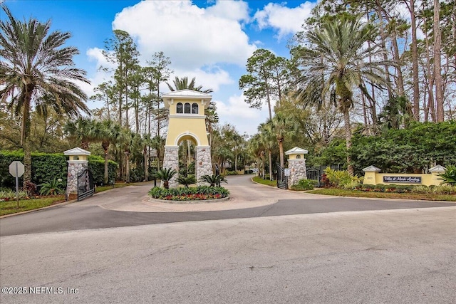 view of property's community featuring a gate