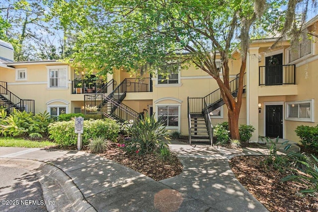 view of property featuring stairs