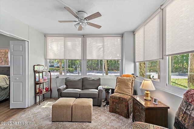 sunroom / solarium featuring wood finished floors