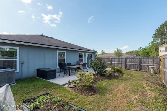 exterior space featuring a fenced backyard, cooling unit, a lawn, a patio, and stucco siding