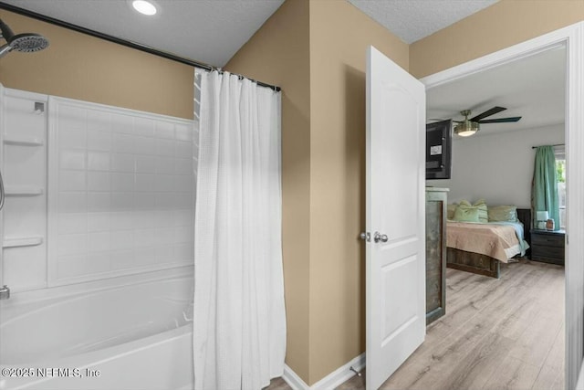 bathroom featuring recessed lighting, wood finished floors, shower / bath combo with shower curtain, ceiling fan, and ensuite bathroom