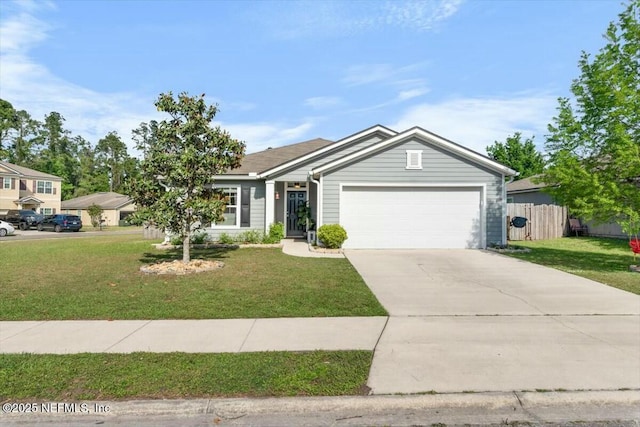 ranch-style home with fence, driveway, a front yard, and a garage