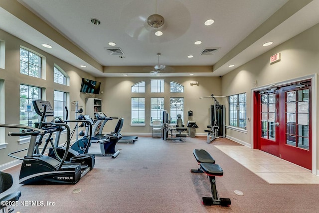 workout area featuring plenty of natural light, a ceiling fan, visible vents, and recessed lighting