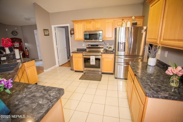 4565 SE 3rd Pl, Keystone Heights, FL 32656 - kitchen with a sink, appliances with stainless steel finishes, light tile patterned flooring, and light brown cabinetry
