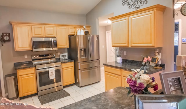 4565 SE 3rd Pl, Keystone Heights, FL 32656 - kitchen with stainless steel appliances, dark countertops, and light tile patterned flooring
