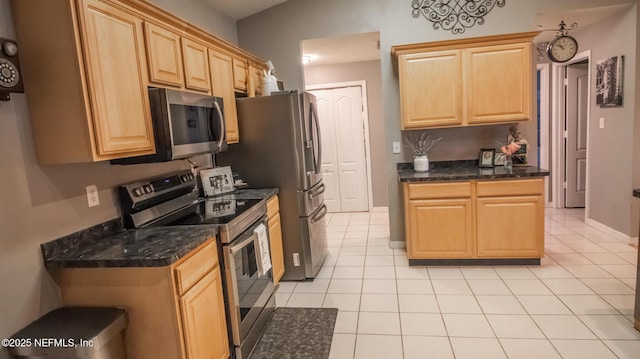 4565 SE 3rd Pl, Keystone Heights, FL 32656 - kitchen featuring light tile patterned floors, light brown cabinetry, and appliances with stainless steel finishes