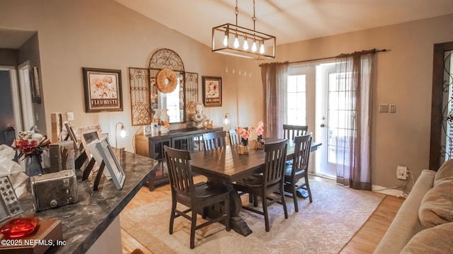 4565 SE 3rd Pl, Keystone Heights, FL 32656 - dining area with light wood finished floors, baseboards, and vaulted ceiling