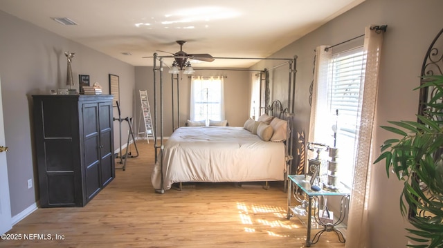 4565 SE 3rd Pl, Keystone Heights, FL 32656 - bedroom featuring visible vents, light wood-type flooring, baseboards, and ceiling fan
