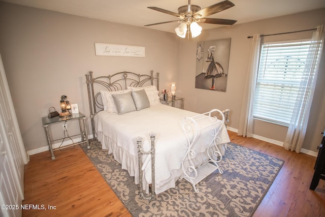 4565 SE 3rd Pl, Keystone Heights, FL 32656 - bedroom with ceiling fan, baseboards, and wood finished floors