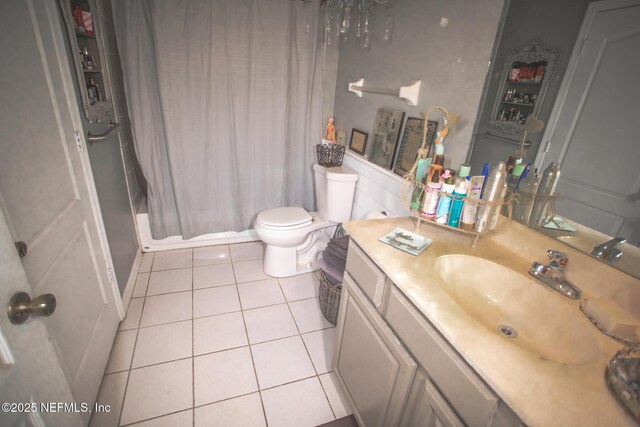 4565 SE 3rd Pl, Keystone Heights, FL 32656 - bathroom with tile patterned floors, vanity, a shower with curtain, and toilet