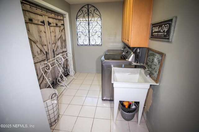 4565 SE 3rd Pl, Keystone Heights, FL 32656 - washroom featuring cabinet space, light tile patterned floors, washer and clothes dryer, and baseboards