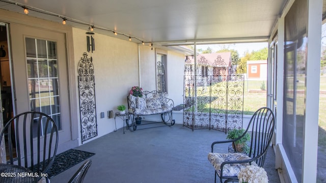 4565 SE 3rd Pl, Keystone Heights, FL 32656 - sunroom / solarium featuring rail lighting and carpet