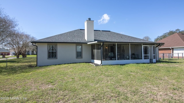 4565 SE 3rd Pl, Keystone Heights, FL 32656 - rear view of house with a sunroom, a yard, stucco siding, fence, and a shingled roof