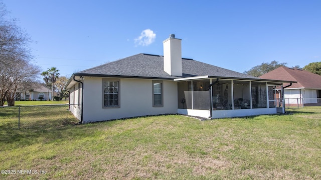 4565 SE 3rd Pl, Keystone Heights, FL 32656 - rear view of house featuring a sunroom, stucco siding, a lawn, fence, and a chimney