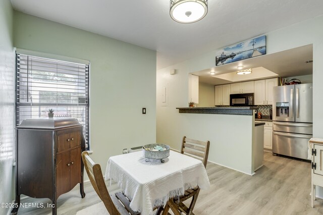 dining room featuring light wood-style floors