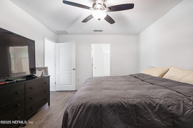 2916 Duck Hollow Ln, Green Cove Springs, FL 32043 - bedroom with wood finished floors, a textured ceiling, and a ceiling fan