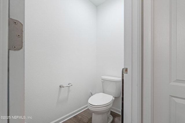 2916 Duck Hollow Ln, Green Cove Springs, FL 32043 - bathroom featuring wood finished floors, baseboards, and toilet