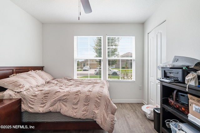 2916 Duck Hollow Ln, Green Cove Springs, FL 32043 - bedroom featuring light wood-type flooring, a ceiling fan, and baseboards