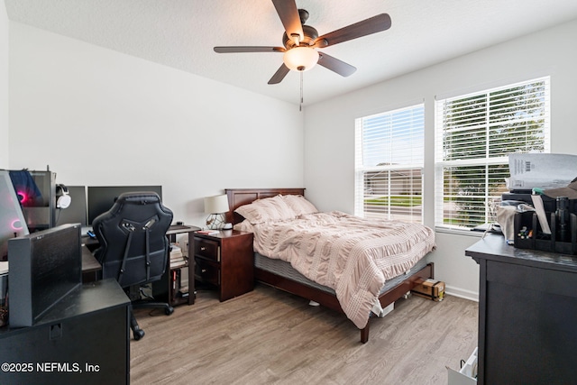 2916 Duck Hollow Ln, Green Cove Springs, FL 32043 - bedroom with light wood finished floors, a desk, and ceiling fan