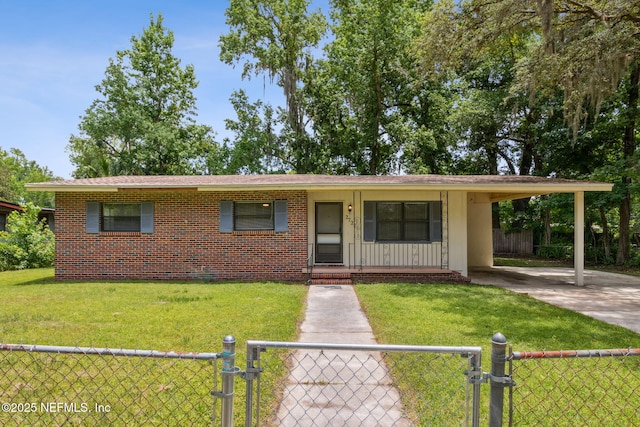 ranch-style house with a carport, driveway, a front lawn, a fenced front yard, and brick siding