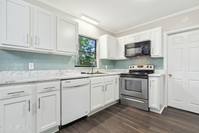 kitchen featuring white cabinets, white dishwasher, a sink, black microwave, and stainless steel electric range