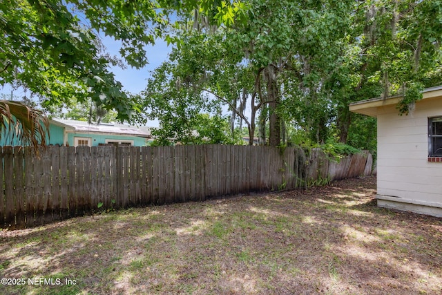 view of yard with a fenced backyard