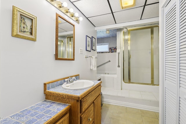 6470 Brooklyn Bay Rd, Keystone Heights, FL 32656 - bathroom featuring a closet, vanity, a garden tub, a shower stall, and a drop ceiling