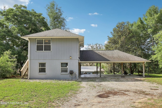 6470 Brooklyn Bay Rd, Keystone Heights, FL 32656 - view of front of property with driveway, stairs, a front lawn, and a shingled roof