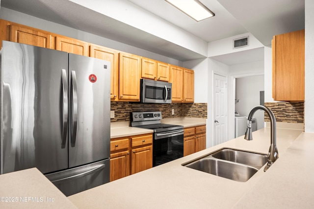 10075 Gate Pkwy N Unit 2505, Jacksonville, FL 32246 - kitchen featuring stainless steel appliances, light countertops, visible vents, a sink, and decorative backsplash