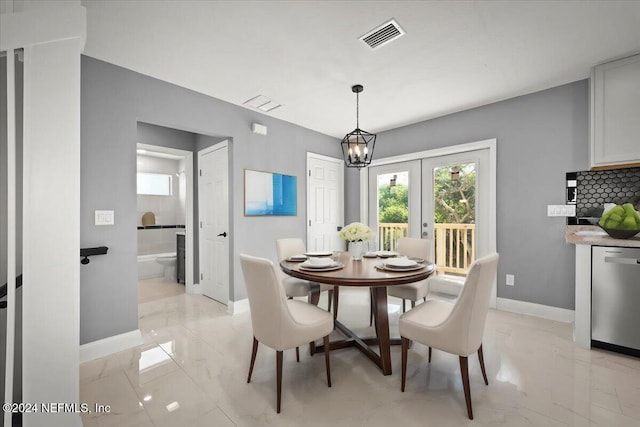 dining area with visible vents, an inviting chandelier, marble finish floor, baseboards, and french doors