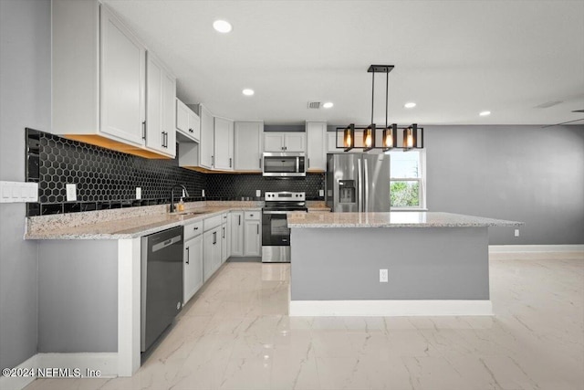 kitchen with decorative backsplash, a sink, baseboards, marble finish floor, and stainless steel appliances