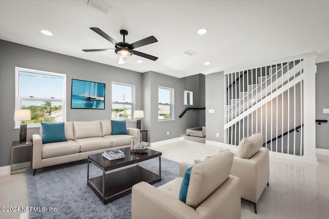 living area with visible vents, recessed lighting, baseboards, and a ceiling fan