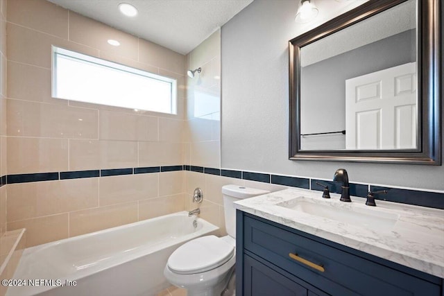 bathroom featuring shower / tub combination, vanity, toilet, a textured ceiling, and tile walls