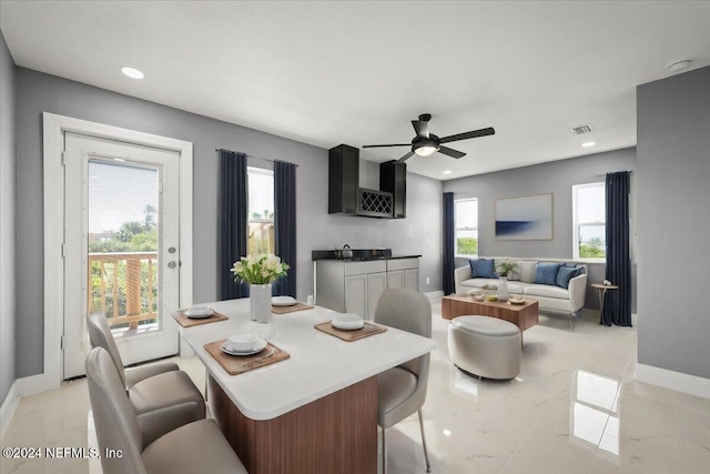 dining area with baseboards, a ceiling fan, recessed lighting, and visible vents