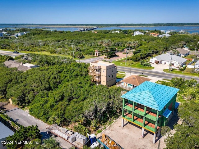 bird's eye view with a water view and a forest view