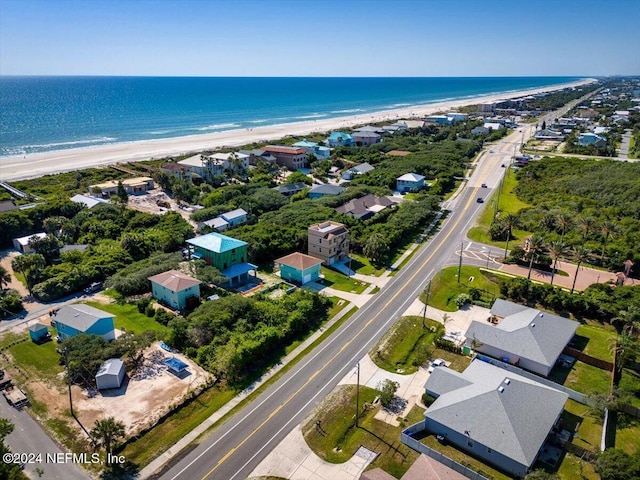 bird's eye view with a water view and a view of the beach