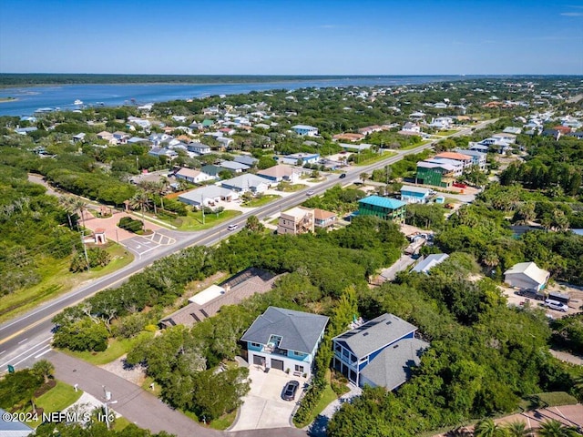 birds eye view of property featuring a residential view and a water view