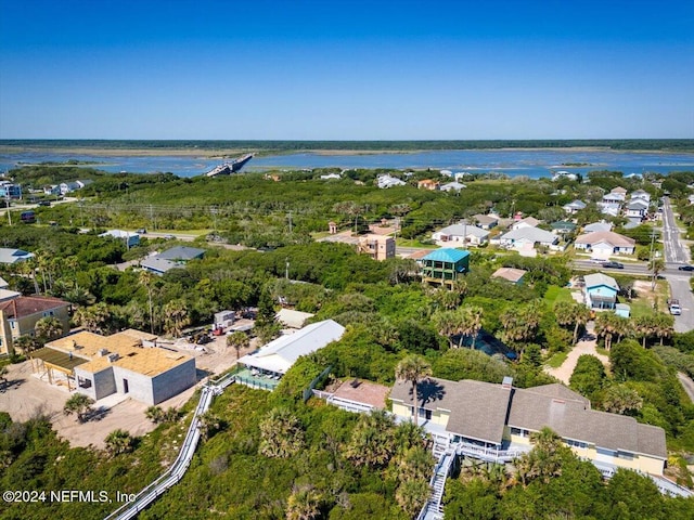 drone / aerial view with a water view and a residential view