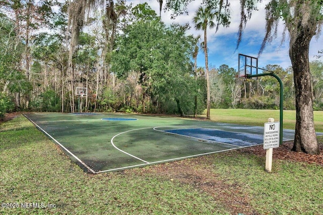 view of basketball court featuring community basketball court and a yard