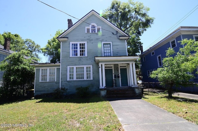 2138 Park St, Jacksonville, FL 32204 - traditional-style house with a chimney and a front yard