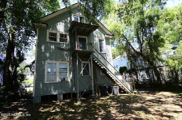 2138 Park St, Jacksonville, FL 32204 - back of house with cooling unit, central air condition unit, a balcony, and stairway
