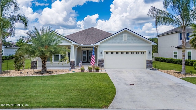 3422 Oglebay Dr, Green Cove Springs, FL 32043 - view of front of property featuring stone siding, a front lawn, french doors, and a garage
